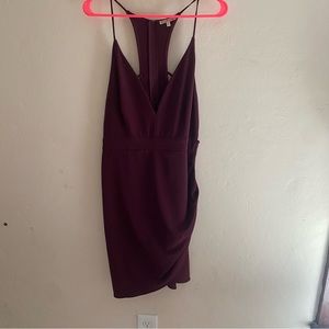 Maroon / burgundy dress with open-detailed back, v neck cut  and thigh slit.